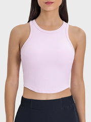 Close front view of pale pink round-neck racerback tank