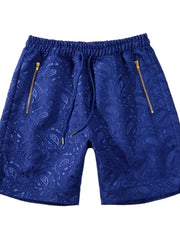 Front view of blue paisley shorts with zip pockets