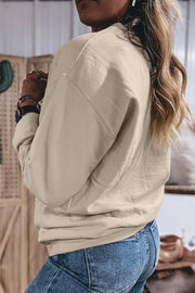 Side/back view showing sweatshirt fit and sleeve
