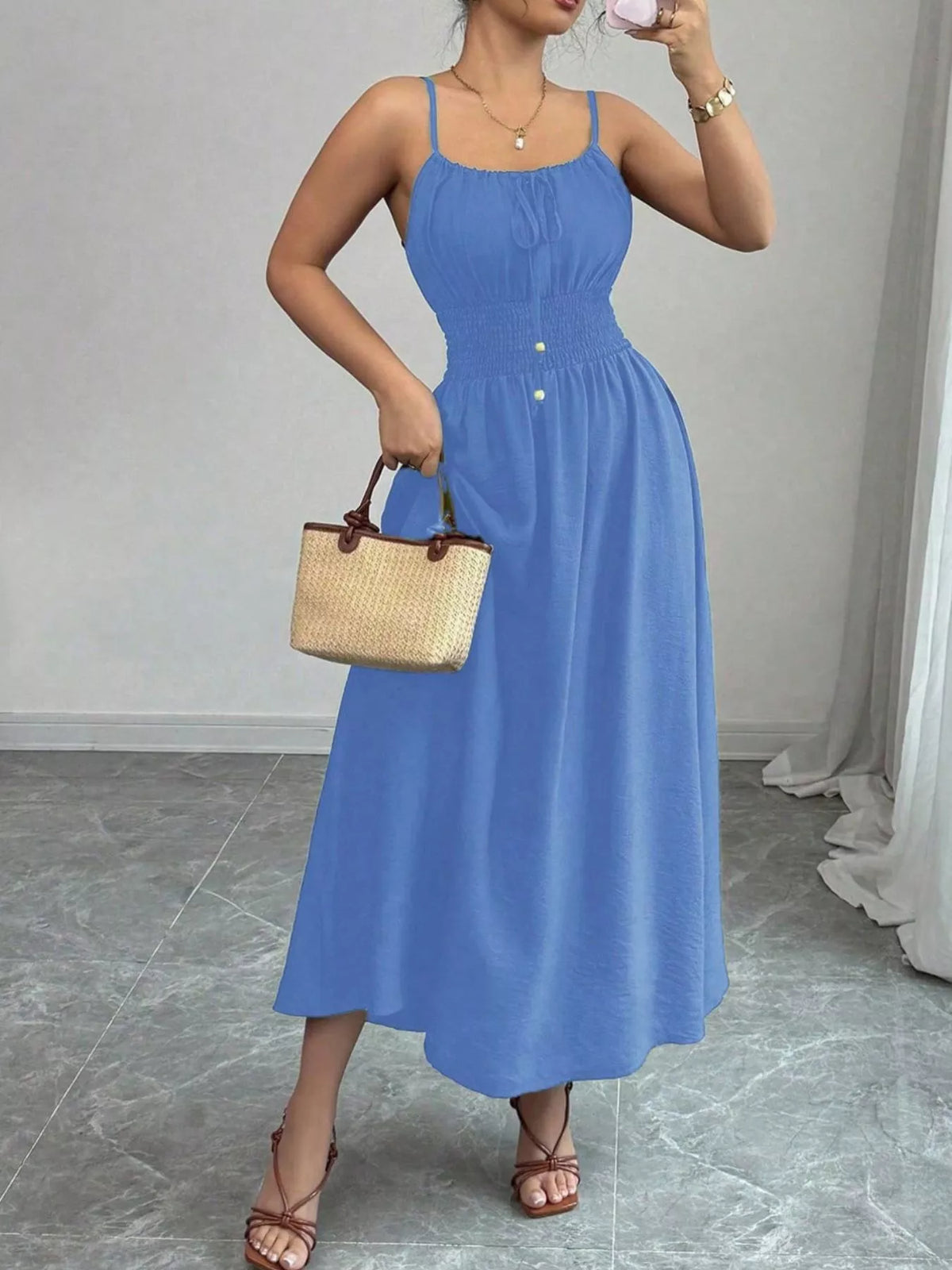 Blue smocked spaghetti-strap midi dress, front view