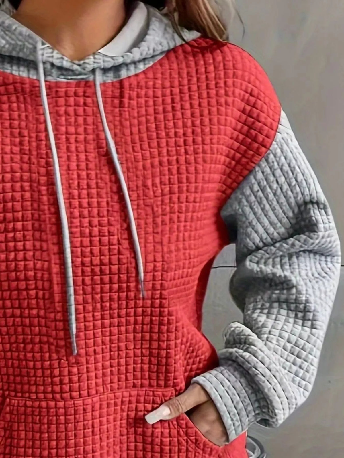 Close-up of red and grey textured hoodie panels