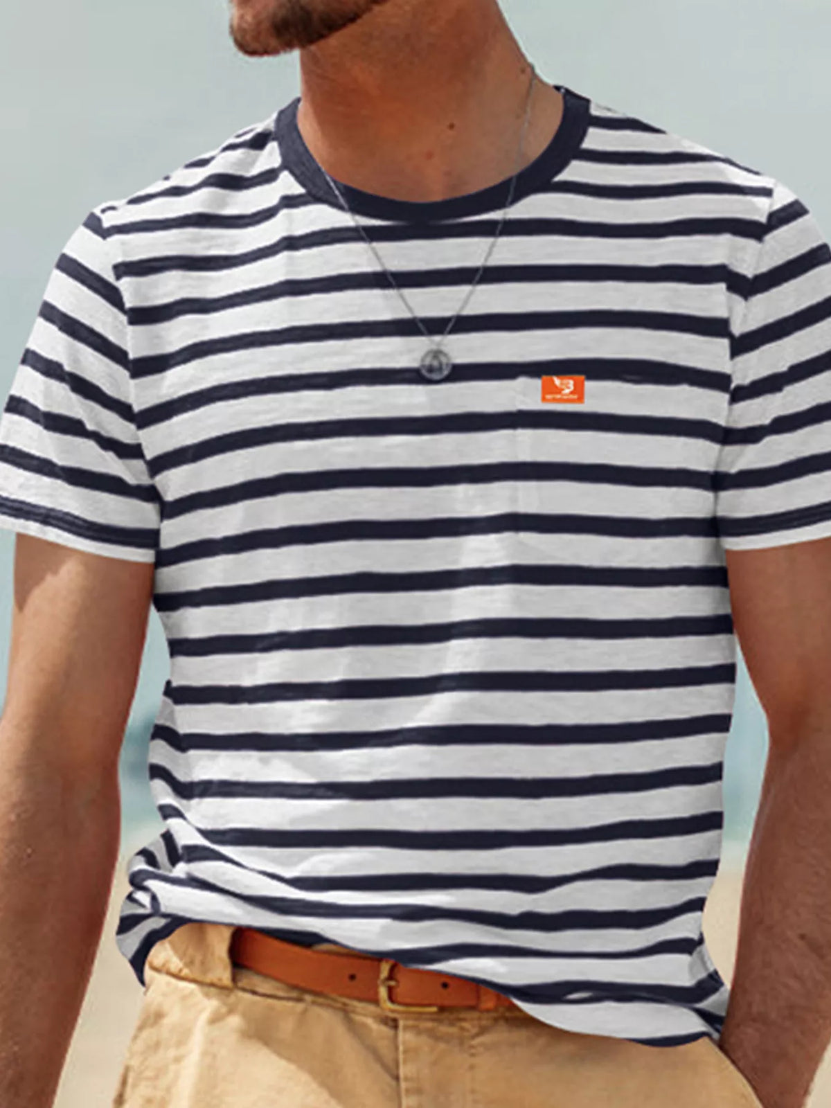 Front view of model wearing navy-and-white striped T-shirt