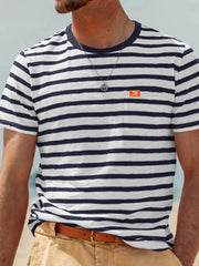 Front view of model wearing navy-and-white striped T-shirt