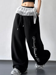Black wide-leg drawstring pants with lace overlay and script print