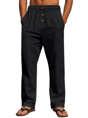 Front view of black pants with elastic drawstring waist and button detail
