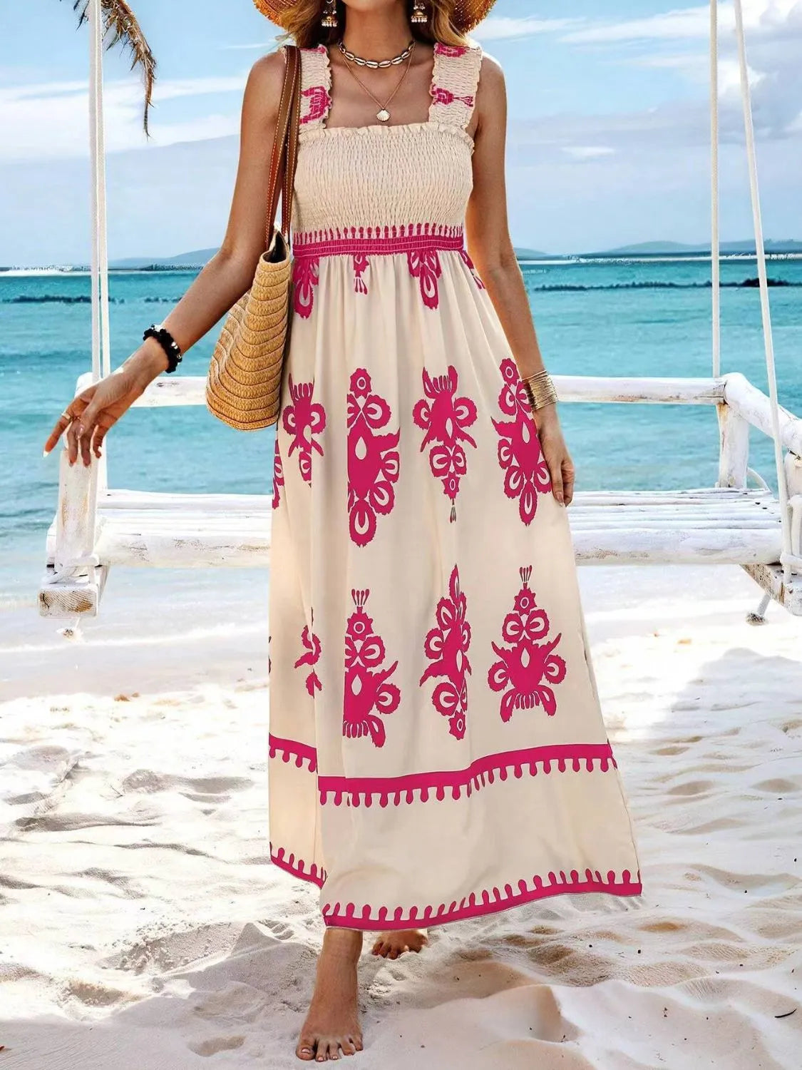 Model wearing cream maxi dress with bright pink floral print