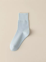 Light blue solid-color crew sock displayed flat