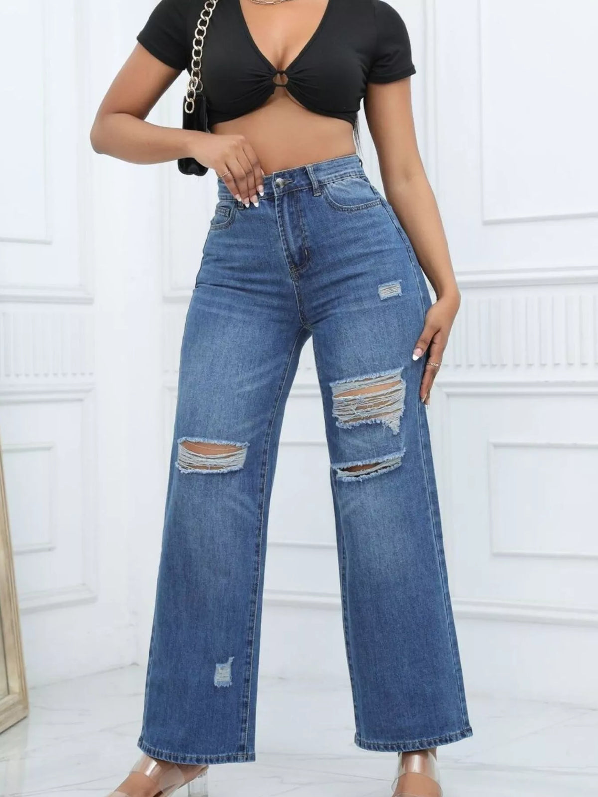 Dark blue ripped wide-leg jeans styled with a black tie-front crop top