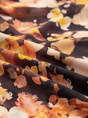 Women's floral V-neck puff-sleeve blouse, close-up of floral print fabric