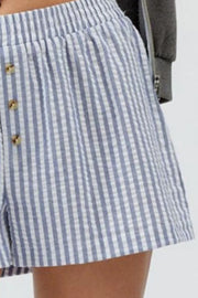 Blue striped shorts showing gathered waist and front buttons