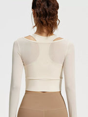 Straight rear view of cream cropped active top with racerback silhouette and wide hem band