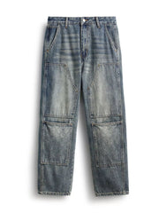 Blue vintage-wash straight-leg jeans laid flat, front view of stitched leg panels