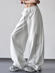 Light gray wide-leg drawstring pants with script leg print