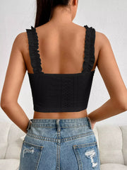 Pink eyelet crop tank with ruffled straps, front view