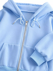 Close-up of light blue hoodie hood drawstrings, zipper and ribbed cuff