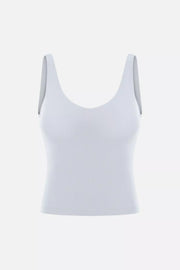 Product view of a white V-neck tank top showing its fitted sleeveless cut.