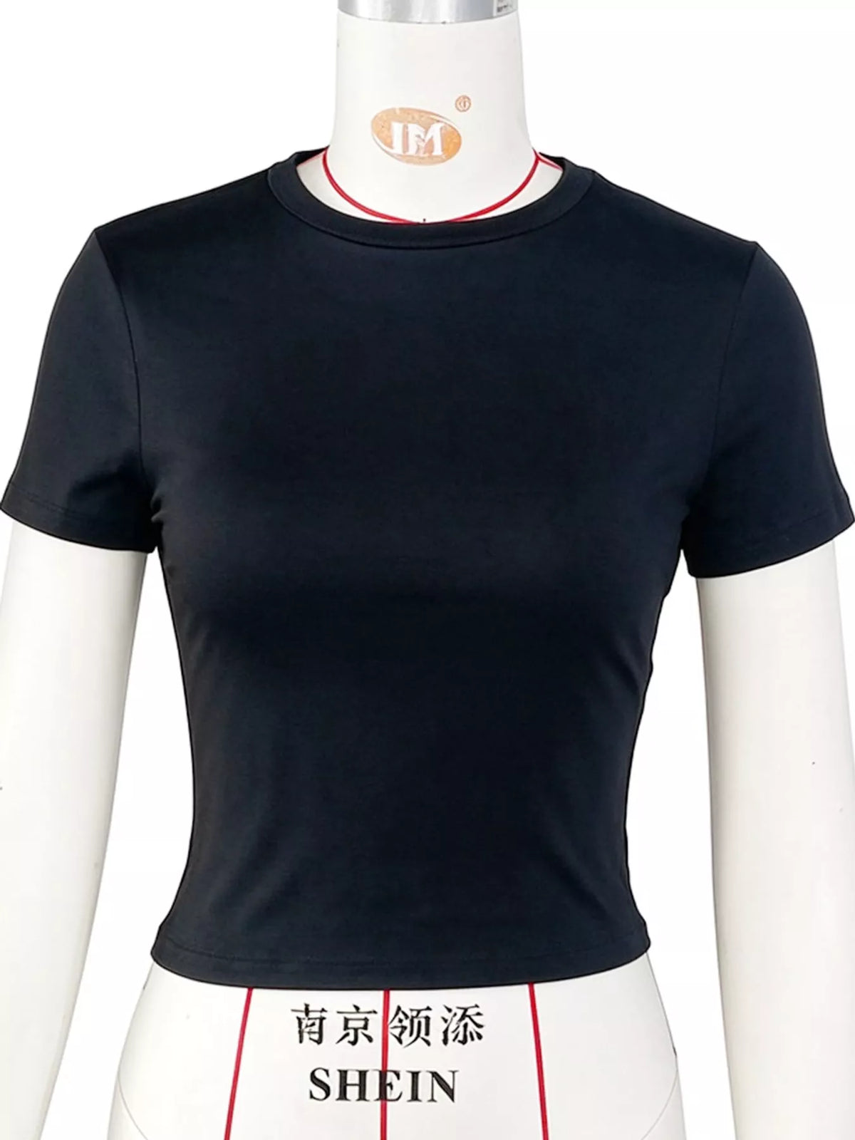 Black fitted cropped crew-neck T-shirt, side view on model