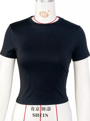 Black fitted cropped crew-neck T-shirt, side view on model
