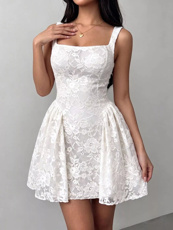 White floral lace mini dress with wide straps, a square neckline and flared skirt.