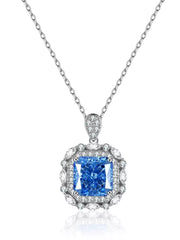 Blue rectangular pendant necklace with decorative clear stone border on white background