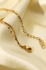 Gold rhinestone bracelet shown on a wrist