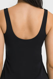 Close-up of the wide straps and low back on a black sports dress.