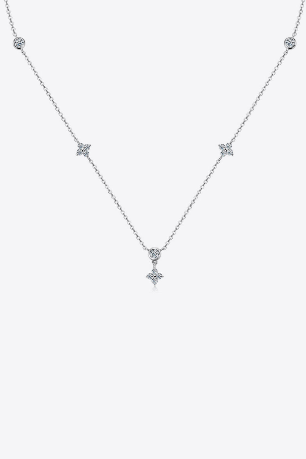 Delicate 925 sterling silver necklace with small spaced stones on white background