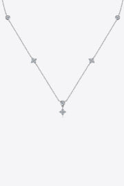 Delicate 925 sterling silver necklace with small spaced stones on white background