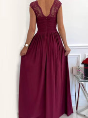 Back view of burgundy maxi dress showing lace straps and gathered bodice