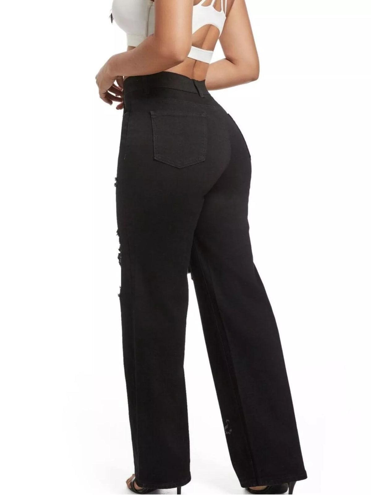 Rear three-quarter view of black wide-leg jeans showing a back patch pocket