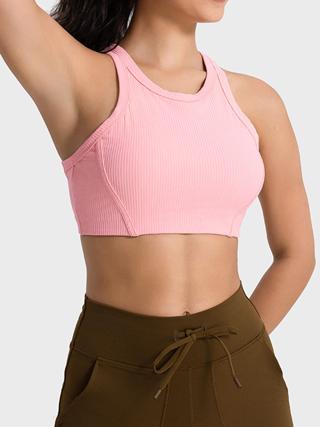 Pink cropped sport tank with wide straps, angled front