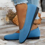 Blue mesh slip-on flat shown from the side on foot