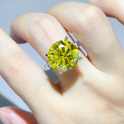 Yellow centre-stone ring worn on hand