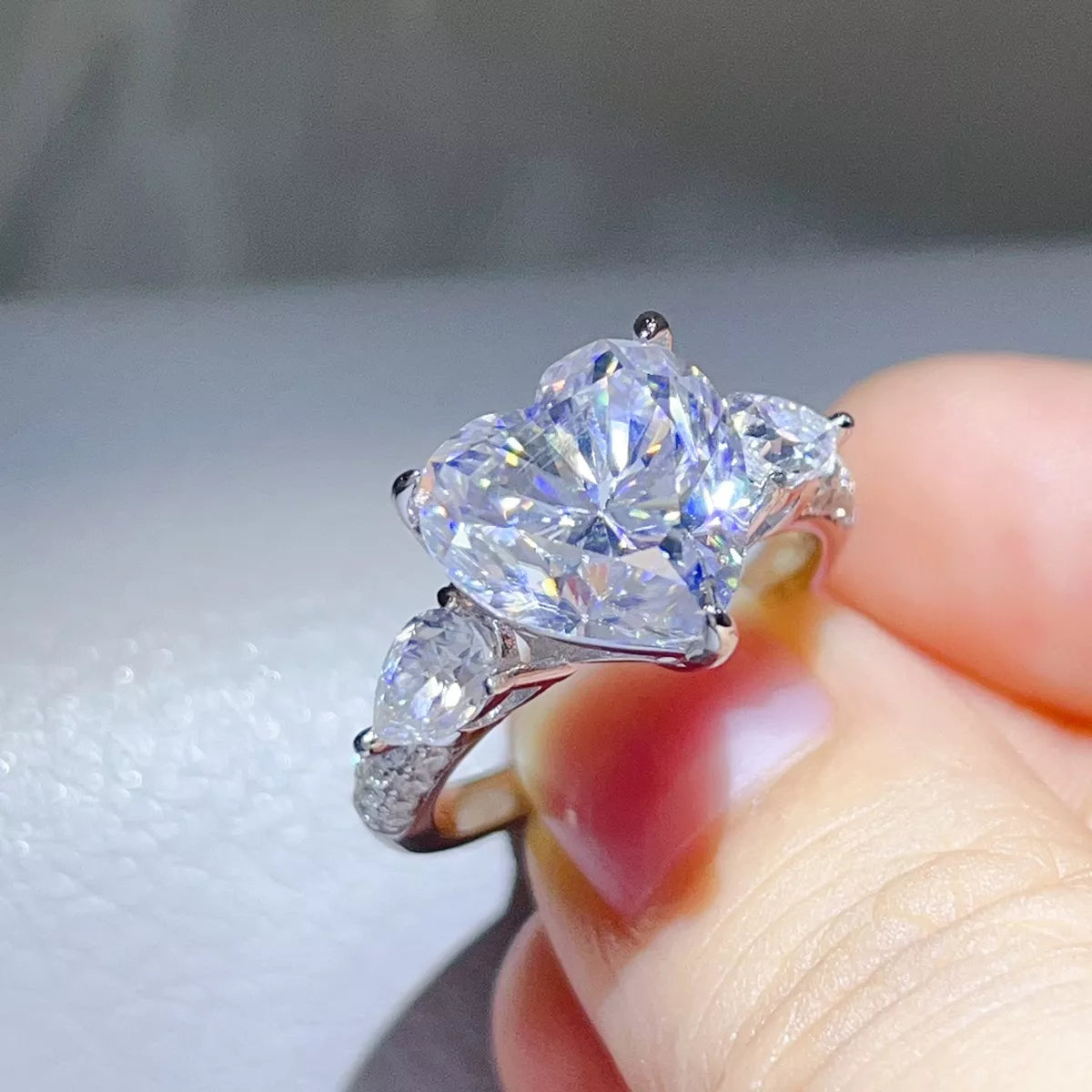 Open presentation box for the clear heart-shaped moissanite ring.