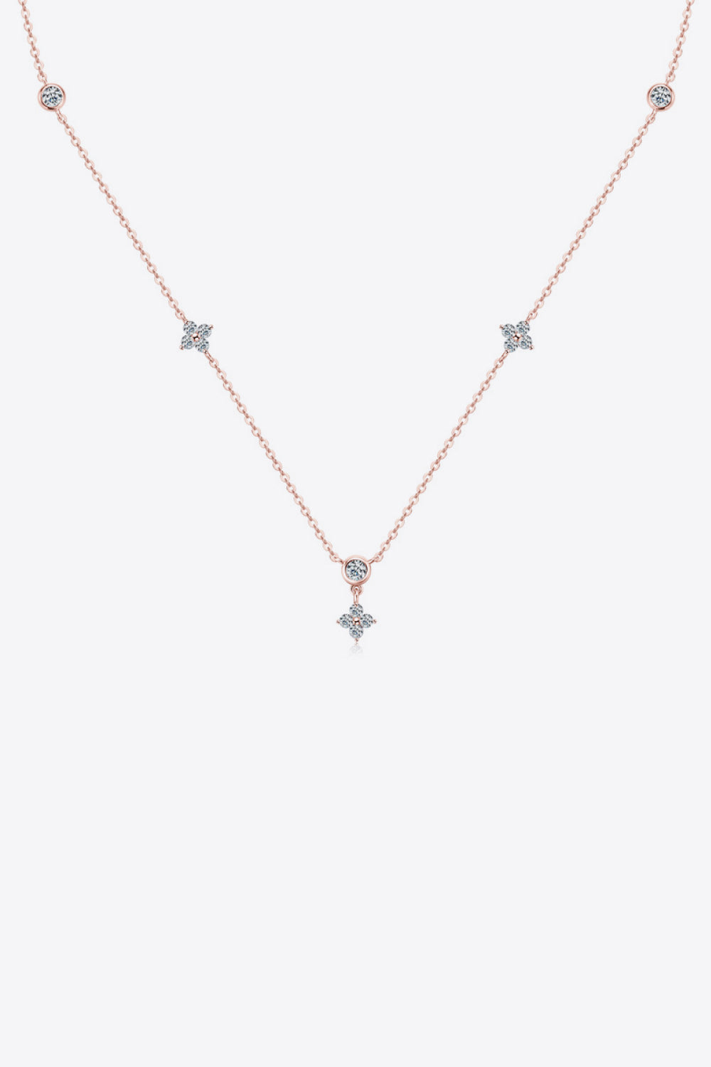 Silver-tone moissanite necklace with spaced stones on white background