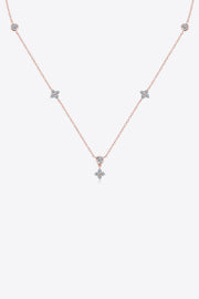 Silver-tone moissanite necklace with spaced stones on white background