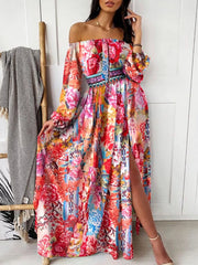 Pink floral off-shoulder maxi dress with a side slit, shown from the front.
