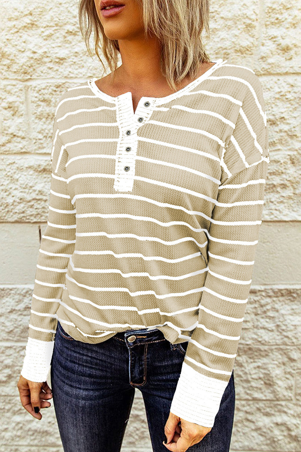 Front view of beige striped Henley top