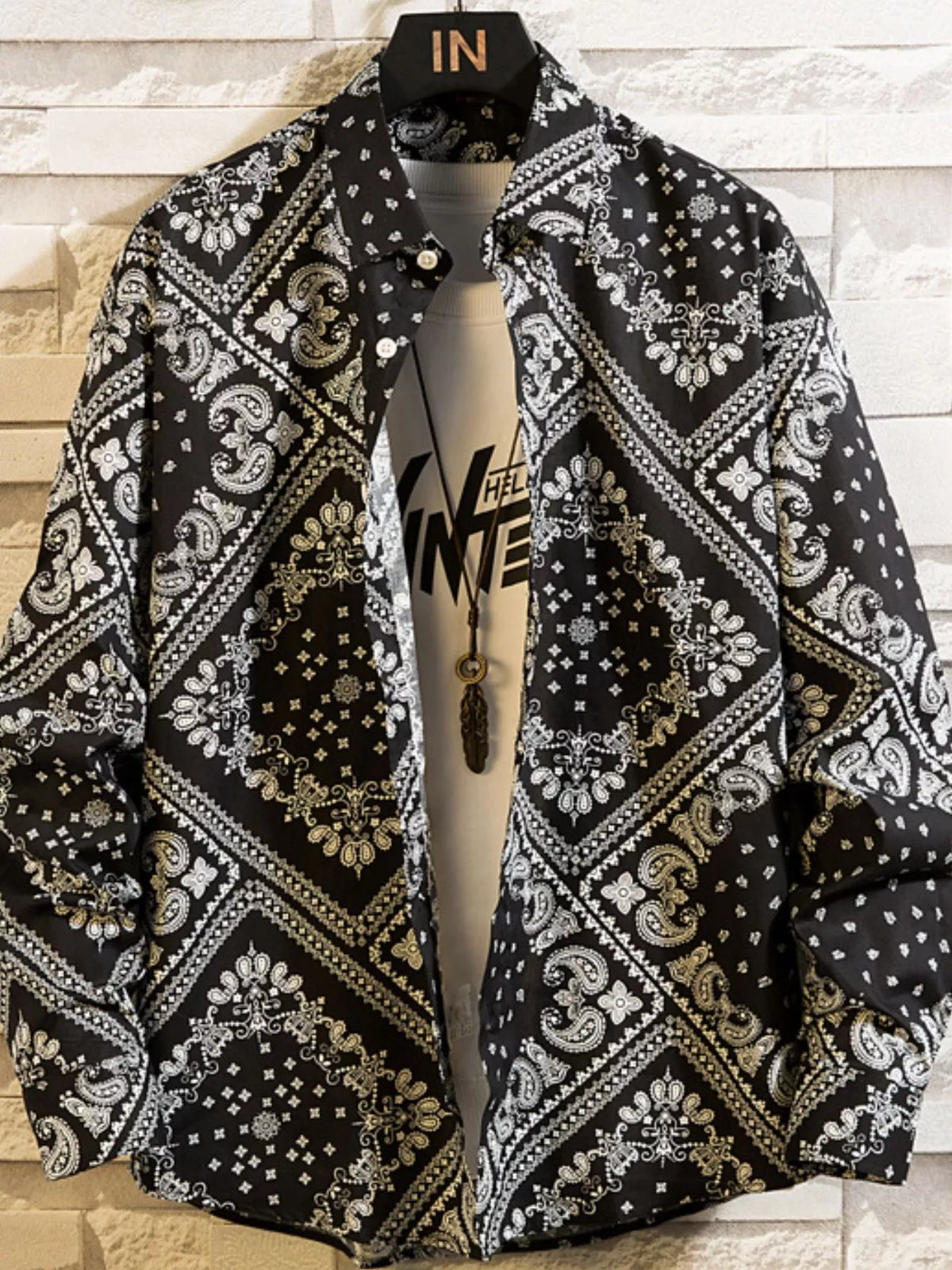 Black shirt with white bandana-style geometric print, front view
