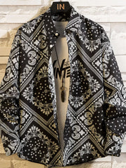 Black shirt with white bandana-style geometric print, front view