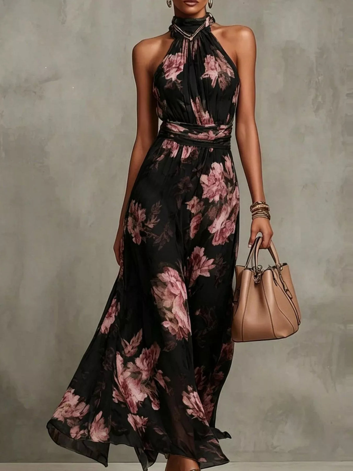 Model wearing a black floral sleeveless tiered maxi dress with a high neckline.