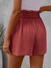 Back view of rose shorts showing their gathered elastic waistband