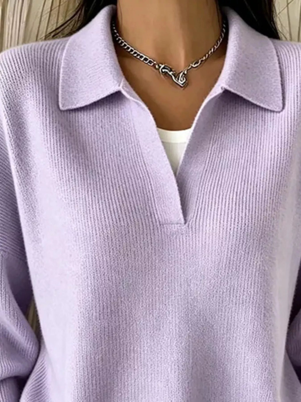 Camel ribbed polo sweater modeled with hands in pockets