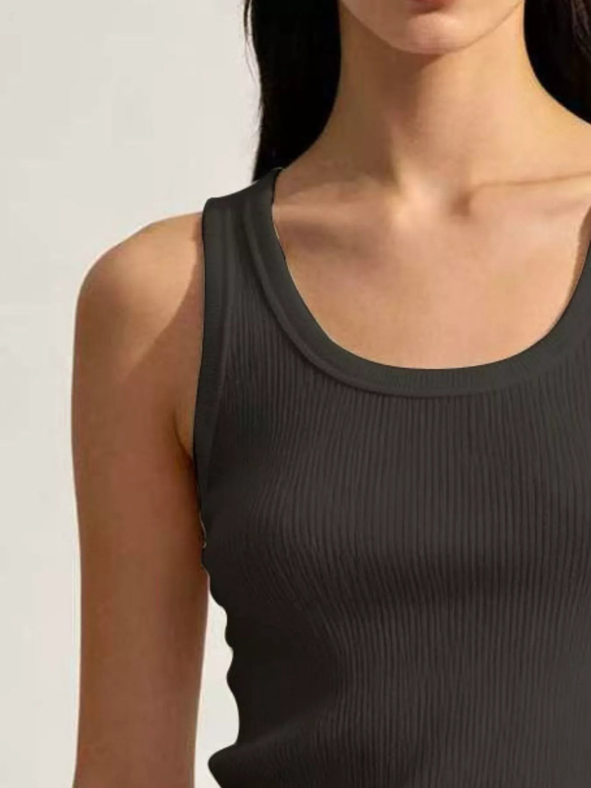 Close-up black ribbed tank neckline