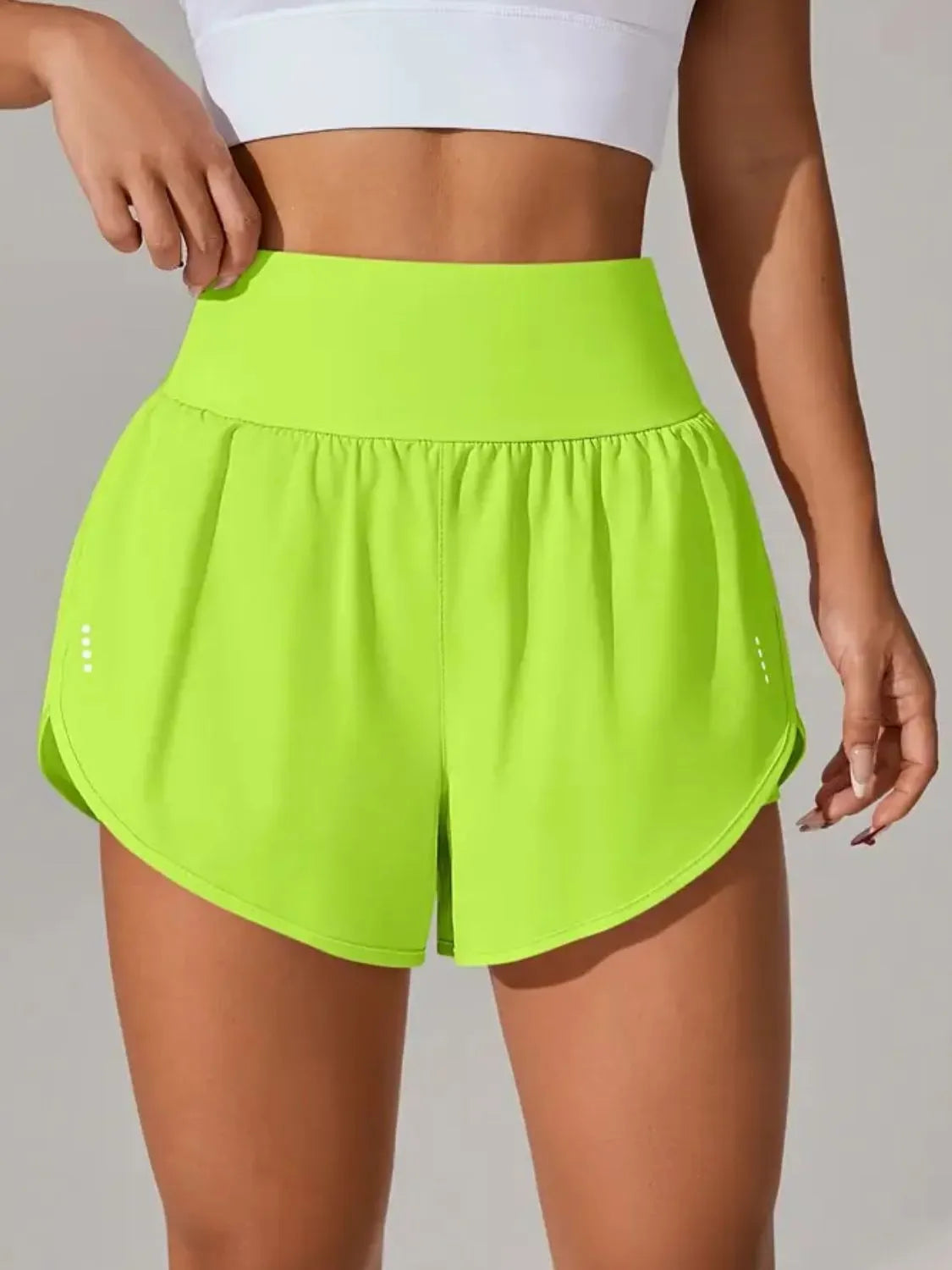 Neon lime high-waisted running shorts, front view