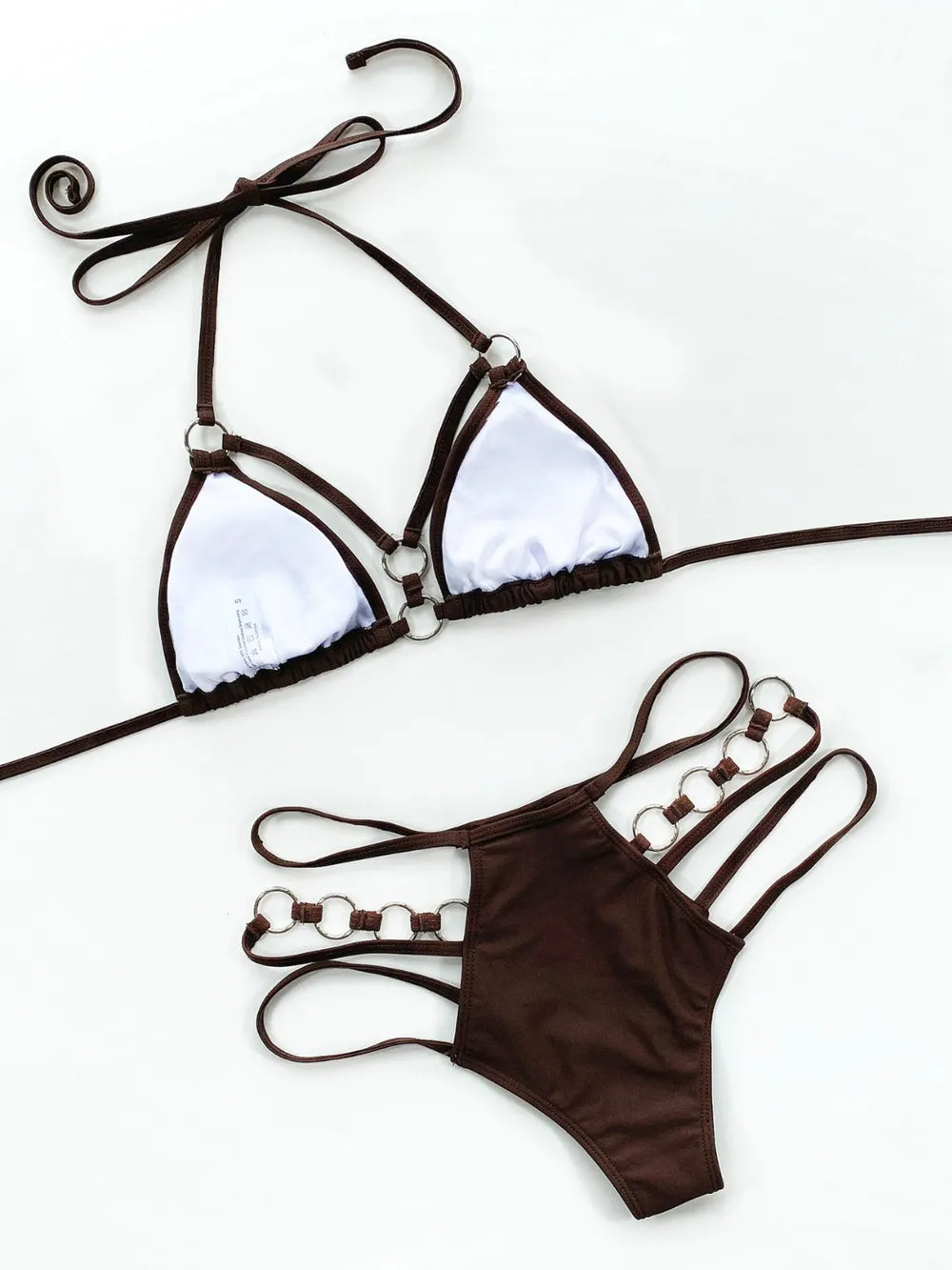 Brown cutout halter bikini set laid flat, showing ring-trim straps