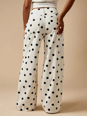 Back view of cream polka-dot wide-leg jeans