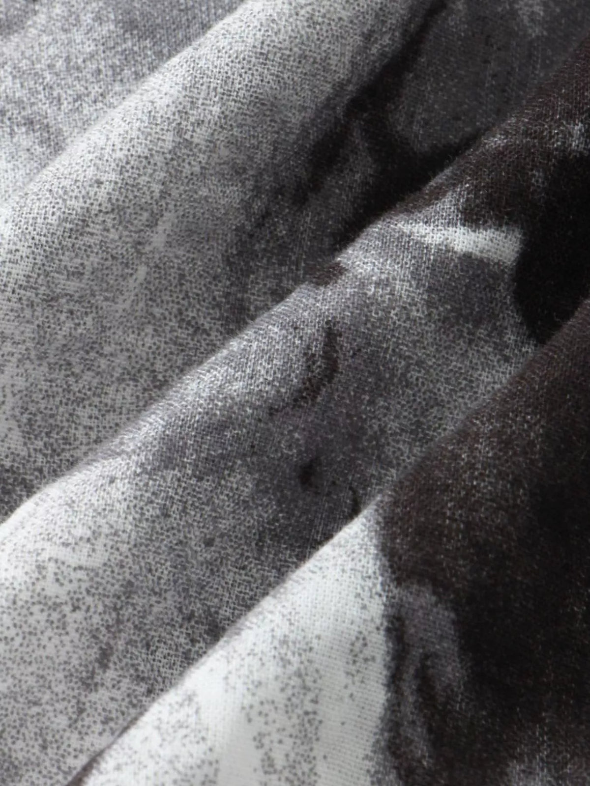 Close-up of charcoal-gray textured shirt fabric