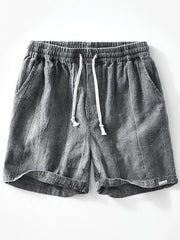 Front view of gray washed shorts with drawstring waist