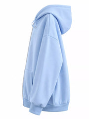 Side view of the light blue hoodie showing the hood and roomy sleeve